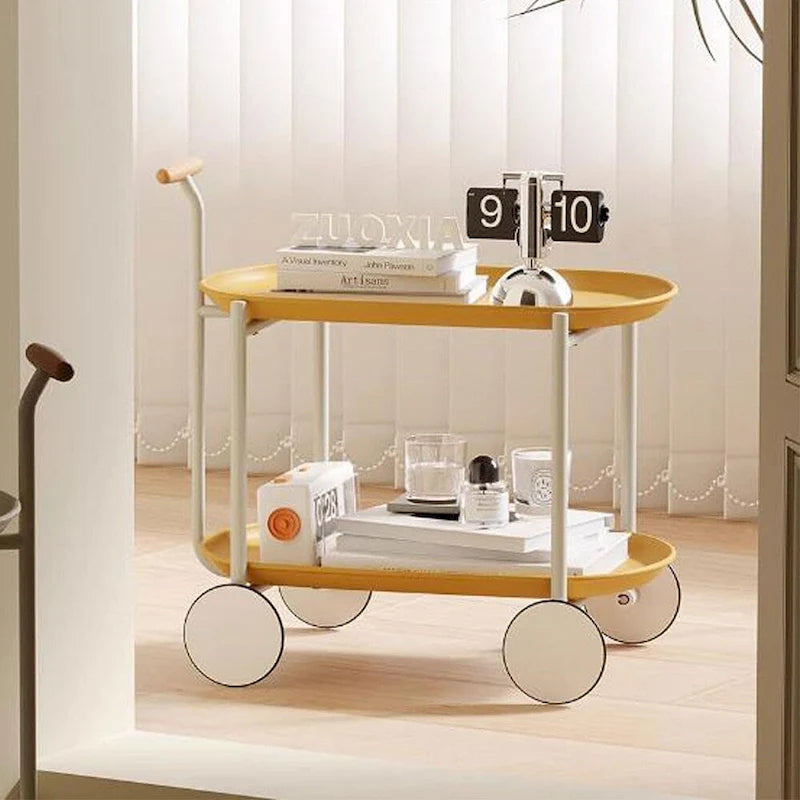 Chariot de service roulant à 2 niveaux en métal avec poignée en bois, plateaux ovales et 4 roulettes crème